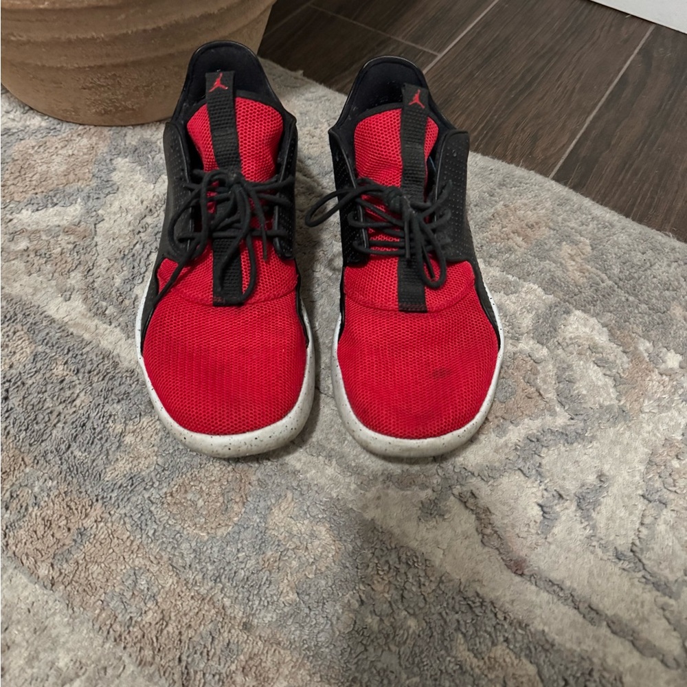 Jordan Red and Black Sneakers with High-Top Design and Cushioned Midsole